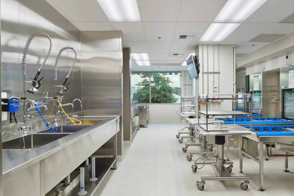 Sterile processing core with equipment power serving the operating suite